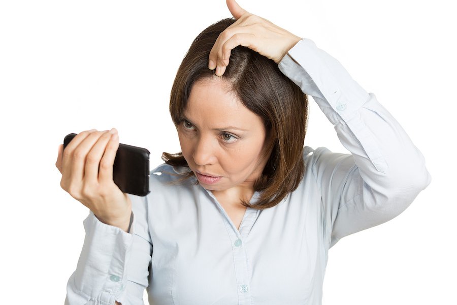 woman checking for hair loss