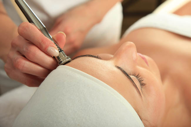 patient receiving microdermabrasion treatment