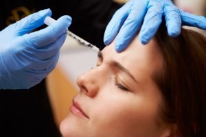 female patient getting forehead injection