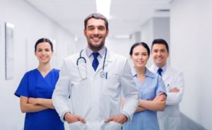 Male doctor and staff