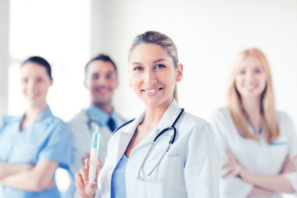 Doctors and nurses standing together