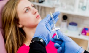 female patient getting facial injection