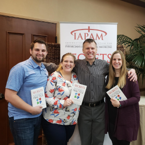 Image of Jeff Russell and attendees at the IAPAM's Aesthetic Medicine Symposium