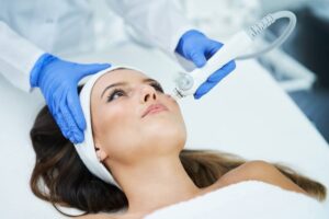 A woman receive a microneedling treatment