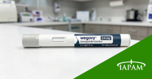 Wegovy injection pen sitting on white counter in doctors office.
