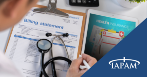Billing statement on a clipboard with a stethoscope, beside a tablet showing health insurance and the TAPAM logo.