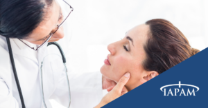 Doctor examining woman's face.