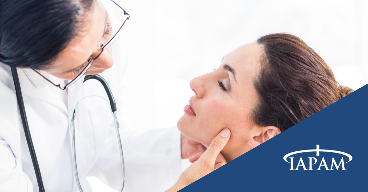Doctor examining woman's face.